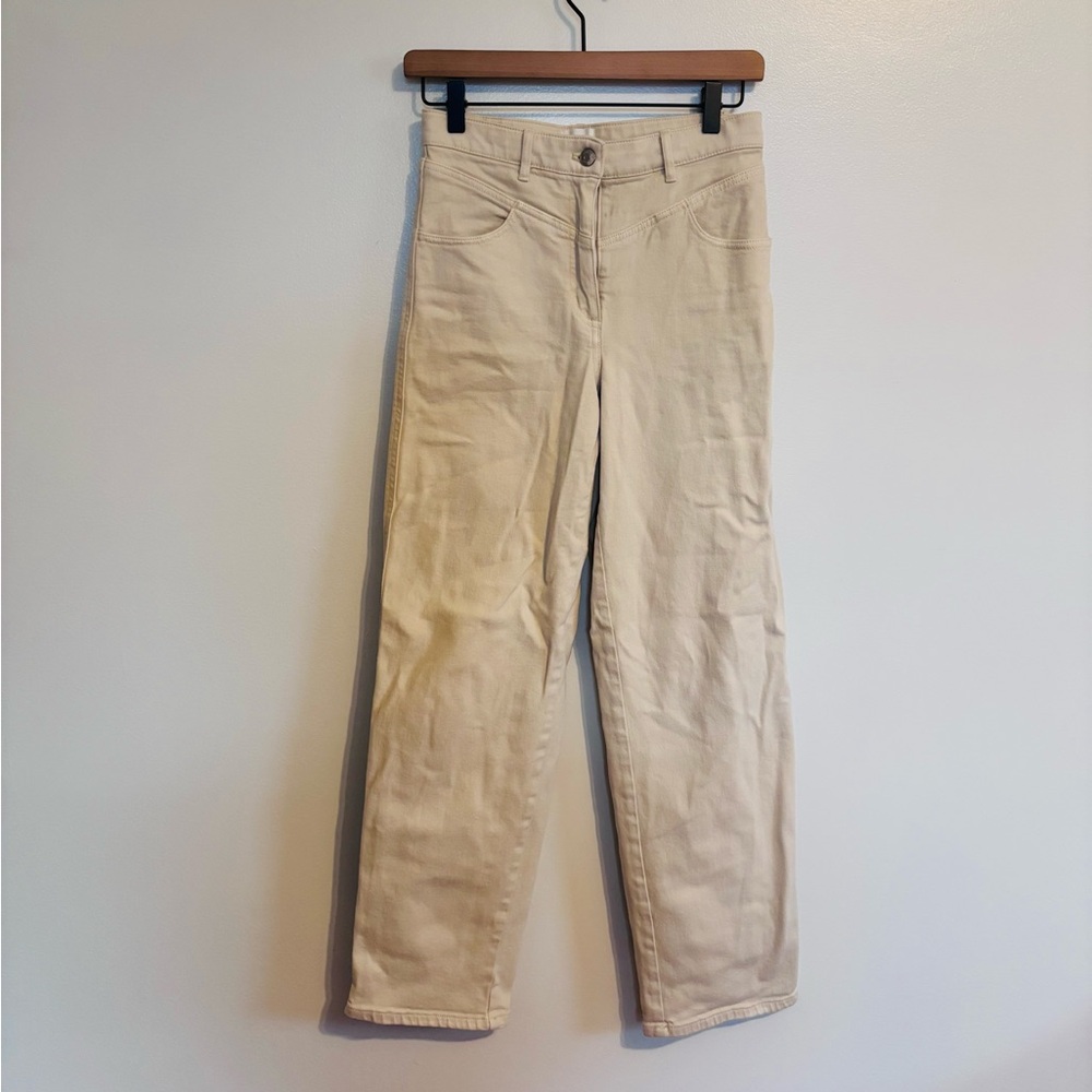 Wilfred free cream beige jeans size 2.  Has a stain on the back of the leg